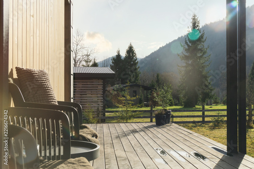 Escape to the outdoor space in the mountain area with nature. A wooden terrace of a cabin or chalet