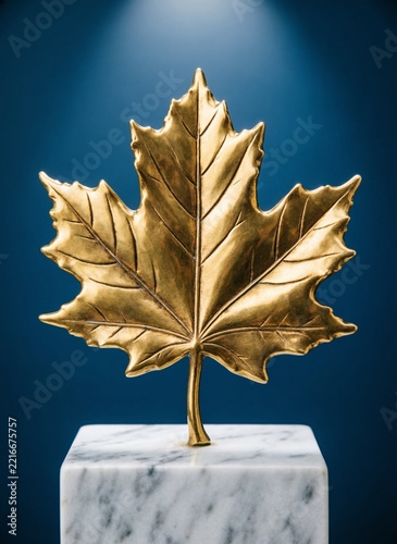 Golden Maple Leaf Statue on White Marble Pedestal Concept for Canadian Award or Autumn Luxury Decor