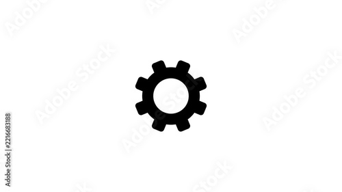 Black cogwheel icon rotating on white background, representing mechanics and industry.