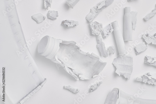 Damaged white objects and ammunition debris close-up