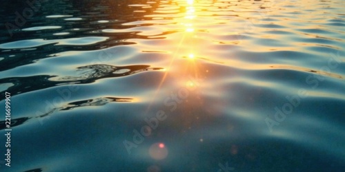 Golden Sunlight Reflecting on Gentle Water Waves at Sunset