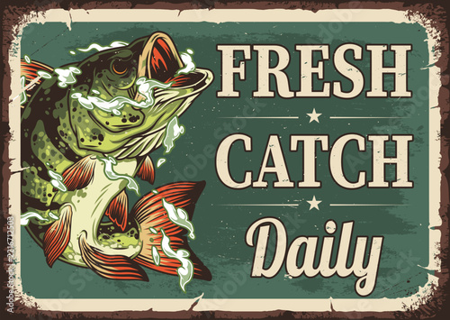 Lush green fish leaps from water with red fins