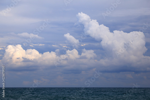 blue sky with clouds over the sea