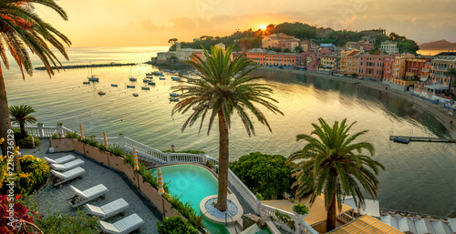Scenic panoramic view of bay and seaside of small resort town Sestri Levante at sunset. Liguria, Italy