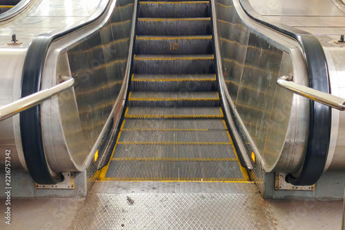 Subway escalator. An electrically powered moving staircase for ascending or descending.