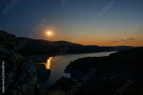 Solar eclipse at the Embalse del Arlanzón Reservoir in Spain, according to