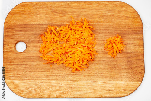 Carrot slices on wooden board, contour