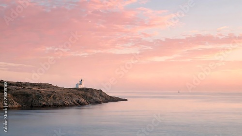 Serene Pastel Sunrise Over a Calm Sea with Rocky Coastline – Peaceful Nature Landscape Background wallpaper 
