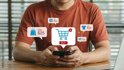 Young Man Shopping Online Using Mobile Phone with Virtual Sales Notifications and Discount Icons Interface