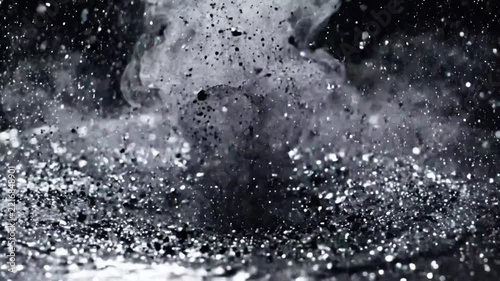 Close-up of water splashing on a reflective surface