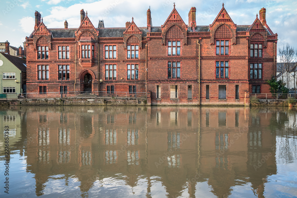 Fototapeta premium Facade of Shire Hall, currently serving as a civil court building, reflected in the River Great Ouse in Bedford, UK