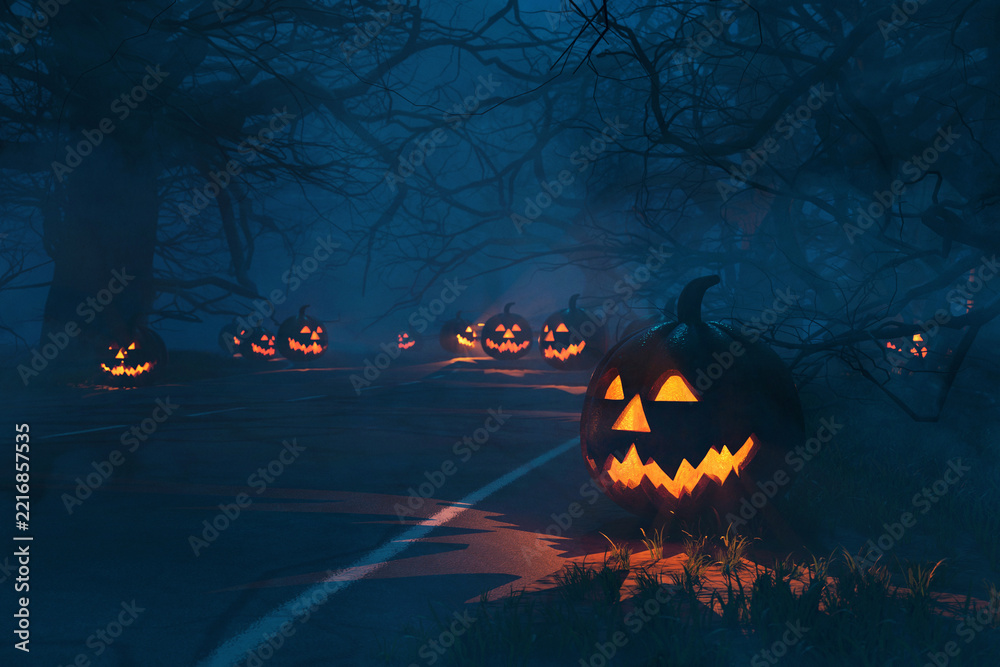 Naklejka premium Spooky Halloween road at night with glowing Jack-o'-lanterns leading into a misty forest of bare branches. One large, carved pumpkin is on the foreground right. Eerie and mysterious.