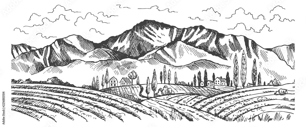 Fototapeta premium A mountain range with a small town in the valley