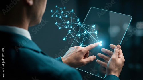 Corporate man touching transparent screen with glowing blue human network