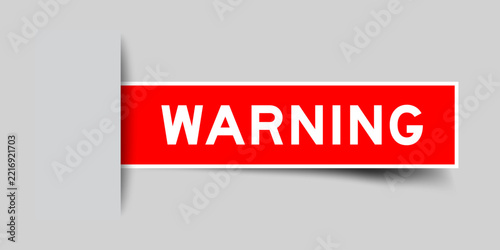 Red color square shape sticker label with word warning on gray background