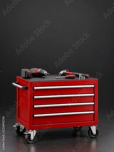 Glossy Red Rolling Tool Chest with Workshop Tools on Charcoal Background