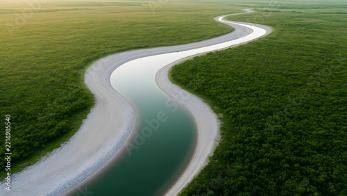 Aerial view of a rewilded river meander with gravel banks, natural floodplain
