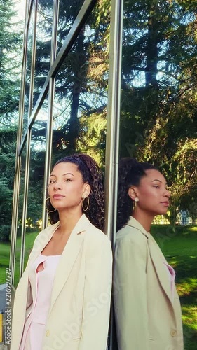 Confident businesswoman reflecting on future goals outside office