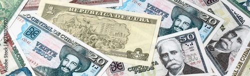 Obraz na plátně Cuban peso money bills in pile on table