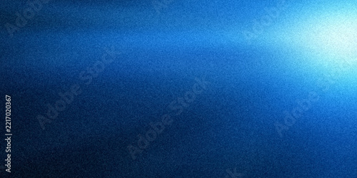 Abstract blue background with soft light glow and grainy texture