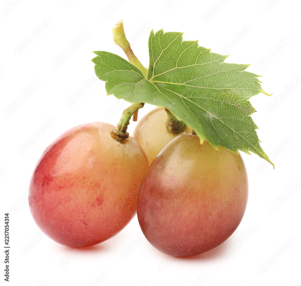 Fototapeta premium Fresh ripe grapes and green leaf isolated on white