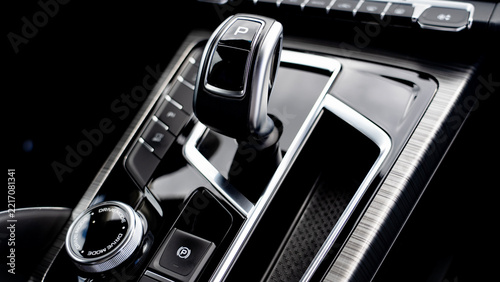 Shiny black gear shift with silver accents