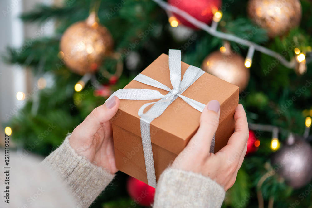 Fototapeta premium Gift box near Christmas tree.