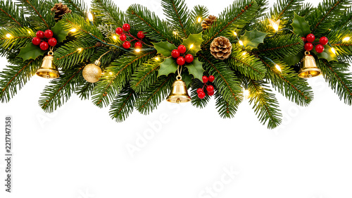 Christmas garland with fir branches holly berries pine cones bells and lights