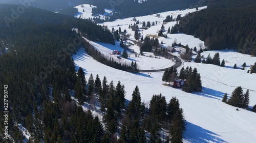 Mountains covered in snow with aerial views showcasing winter