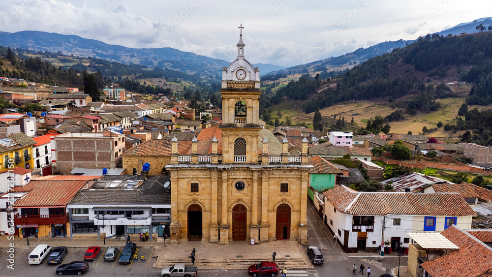 Fototapeta premium Pesca, Boyaca - Colombia. March 3, 2026. Panoramic drone view of the town's main church.