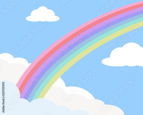 Colorful Rainbow in Blue Sky with Soft White Clouds