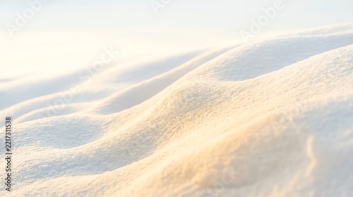 Abstract Snow Dunes Illuminated by Warm Golden Light