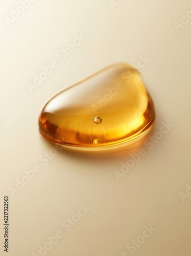 Shiny drop of honey on a golden background in macro view.”   Please let me know