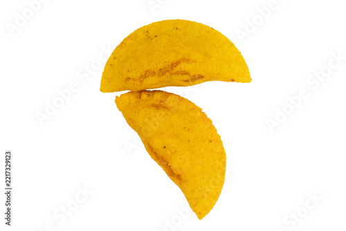 Two golden fried Colombian empanadas isolated on transparent PNG