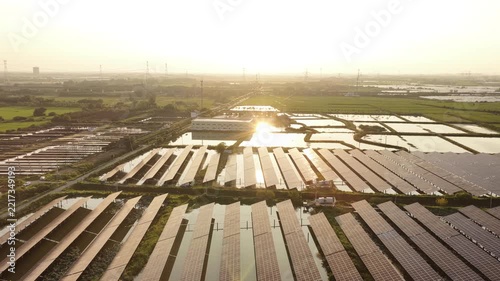 aerial view of solar power fishery complex at sunset