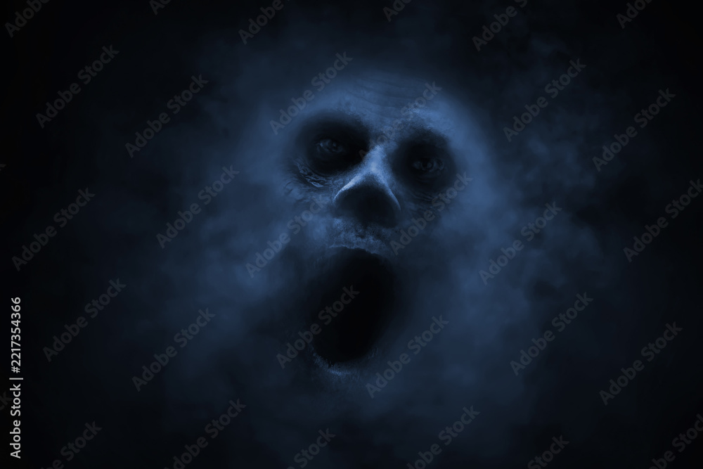 Naklejka premium Screaming ghost face on black background with smoke mist fog, Halloween theme