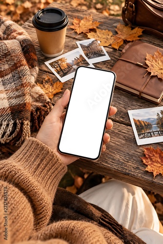Mobile phone screen mockup with fall leaves coffee and blanket mockup ready to use