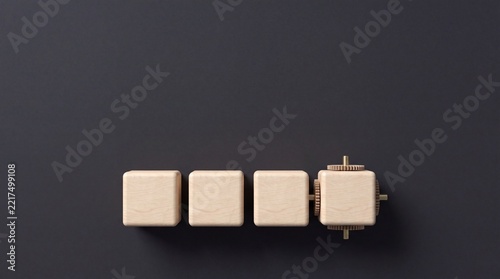 Minimalist Top Down View of Wooden Blocks with Integrated Gear Mechanism Representing Automation Industrial Innovation and Efficiency Concept on Dark Background for Business Growth