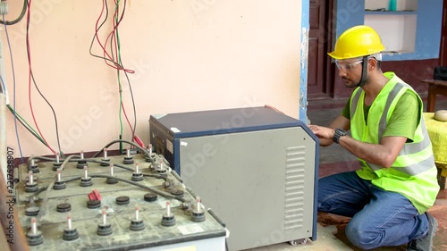 Technician installing solar panel inverter system in Farrukhabad