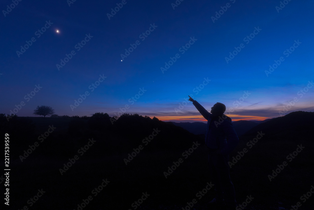 Fototapeta premium Amateur astronomer observing stars, planets and other celestial objects.