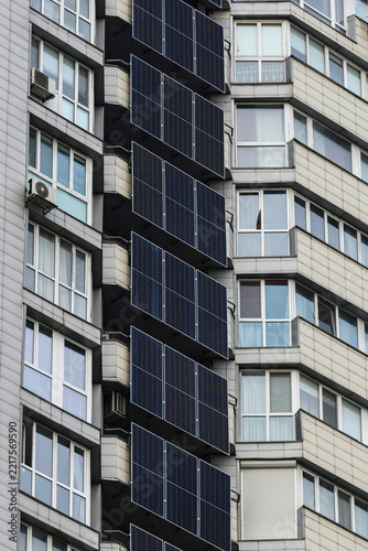 Solar panels and a battery storage system mounted on a modern apartment building in Kyiv, Ukraine, providing renewable energy and backup power for residential use.