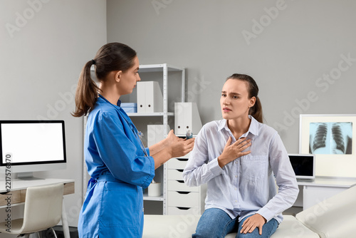 Asthma treatment and respiratory health, doctor consulting patient with breat...