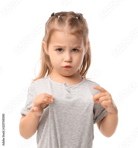 Fotografie Childhood emotions and behavior, little girl with a grumpy expression and pouty