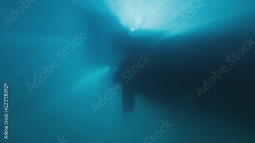 Sailing boat as seen from the bottom of the sea, underwater view of the rudder and keel of a sailing boat