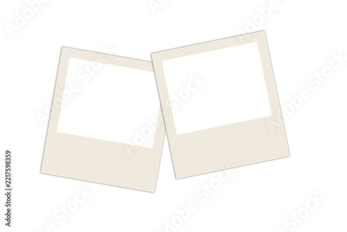 Two blank vintage polaroid photo frames tilted and overlapping, isolated on white background