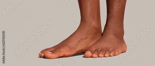 A close-up of a person's bare feet, standing on a neutral background. The skin tone is dark, and the feet appear healthy and clean