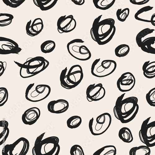 Abstract hand drawn black ink scribble seamless pattern with doodle circles and brush strokes, minimalist vector texture background for modern apparel, packaging, and wallpaper