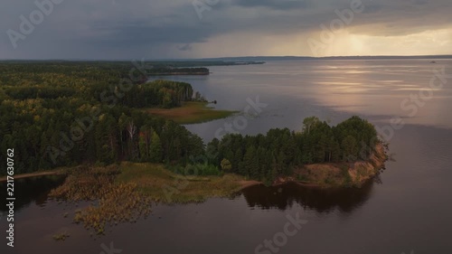 Coastline of the Votkinsk reservoir of the Kama river in Russia during rainy and stormy day