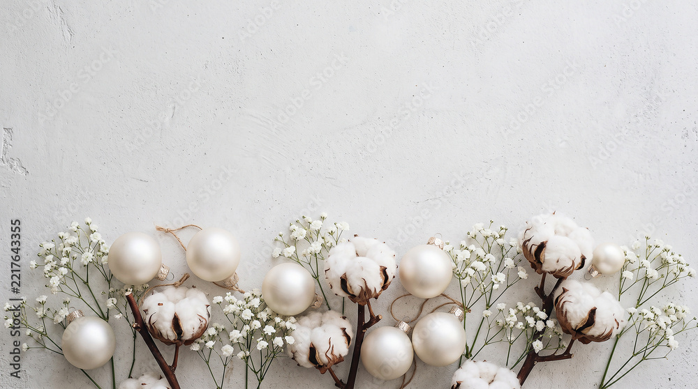 Fototapeta premium Pearl white baubles, cotton and gypsophila on plaster