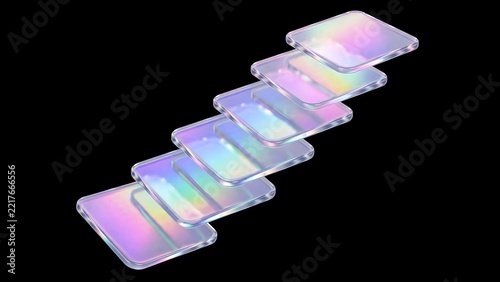 Stack of iridescent glass tiles against black background